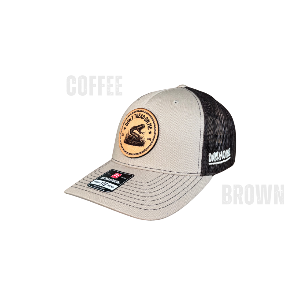 Heather grey and white Richardson 112 trucker hat with leather Thin Blue Line American flag patch by Dark Horse.