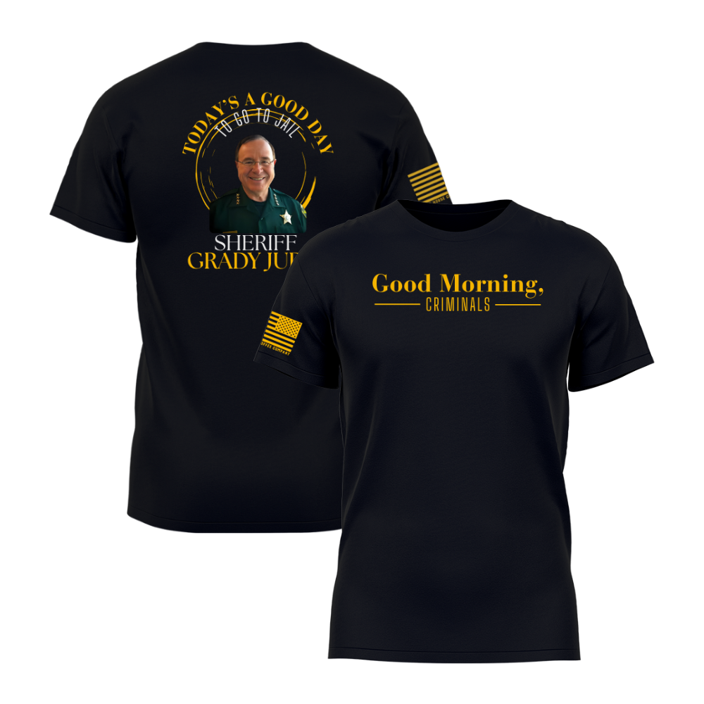 Front and back view of a black “Good Morning, Criminals” t-shirt featuring Sheriff Grady Judd graphic on the back and gold American flag sleeve detail.