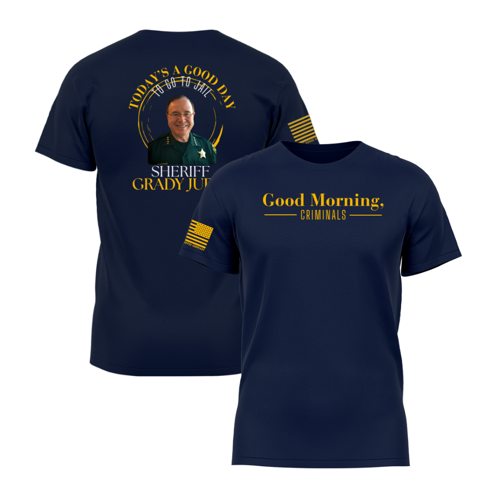 Front and back view of a navy blue “Good Morning, Criminals” t-shirt featuring Sheriff Grady Judd graphic on the back and gold American flag sleeve detail.