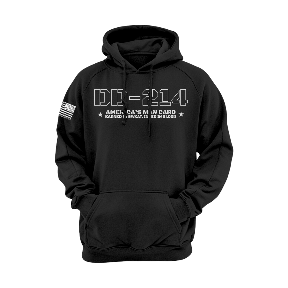 Black DD-214 hoodie with white stencil text “America’s Man Card” and flag sleeve—veteran pride design.